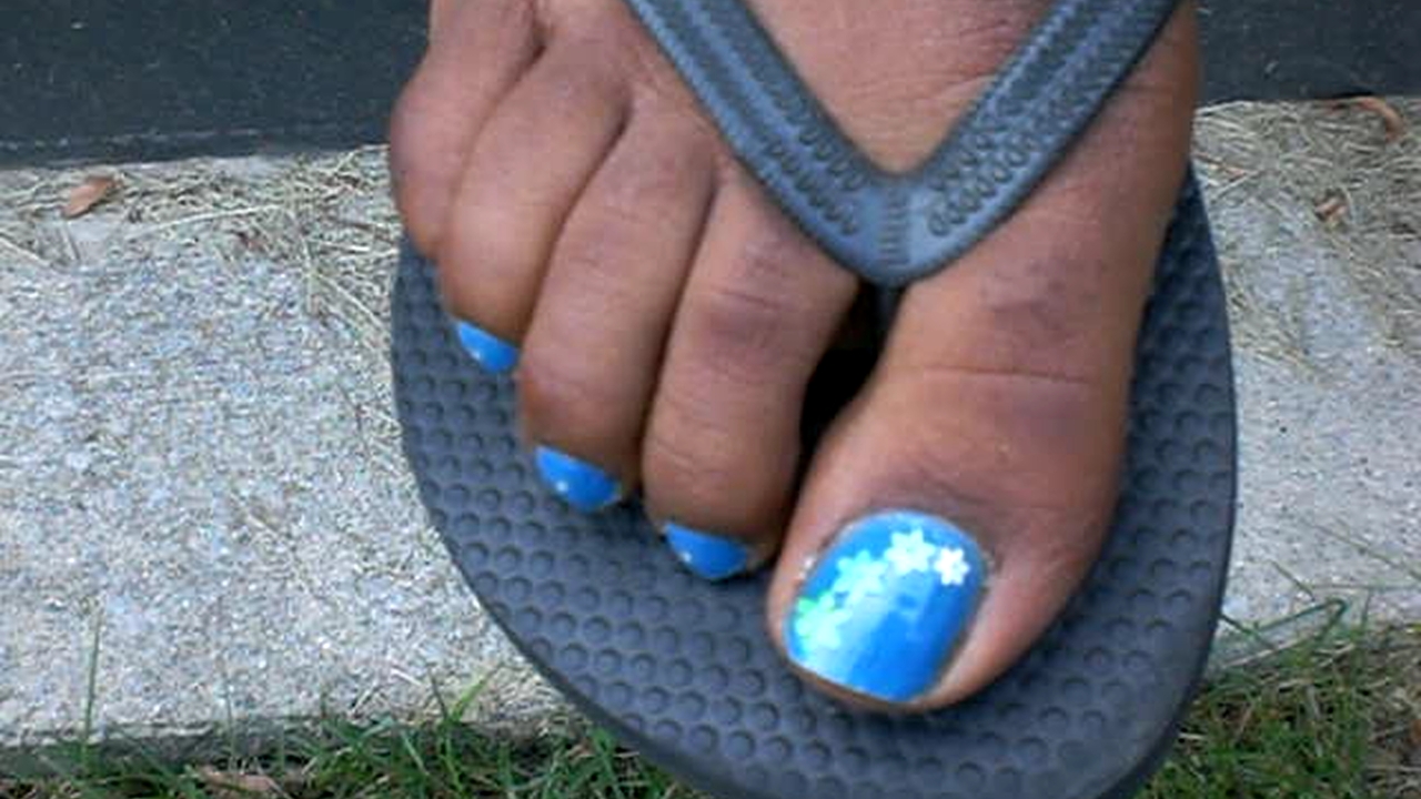 a girl showing her toes and talking about a guy who asked to suck them