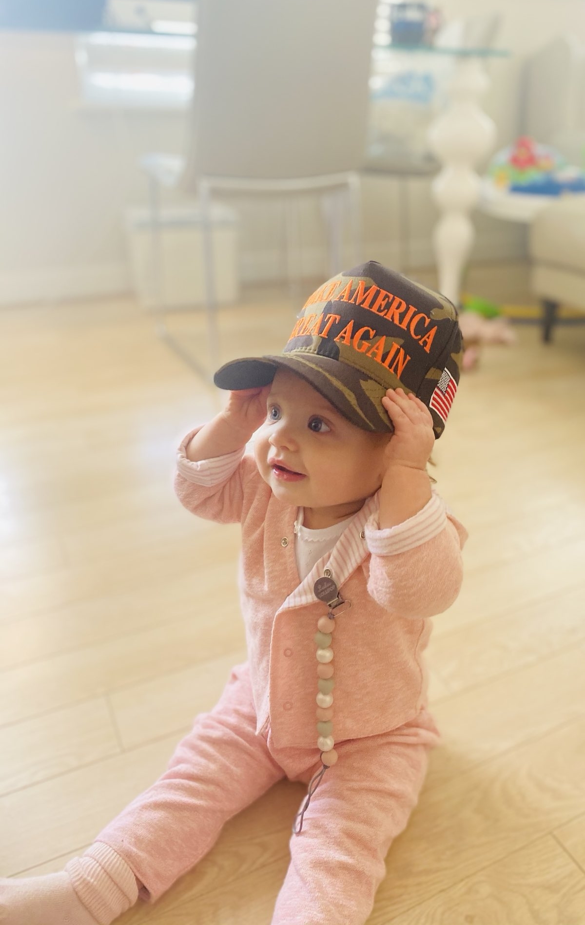 Kayleigh McEnany's baby wearing a Maga cap