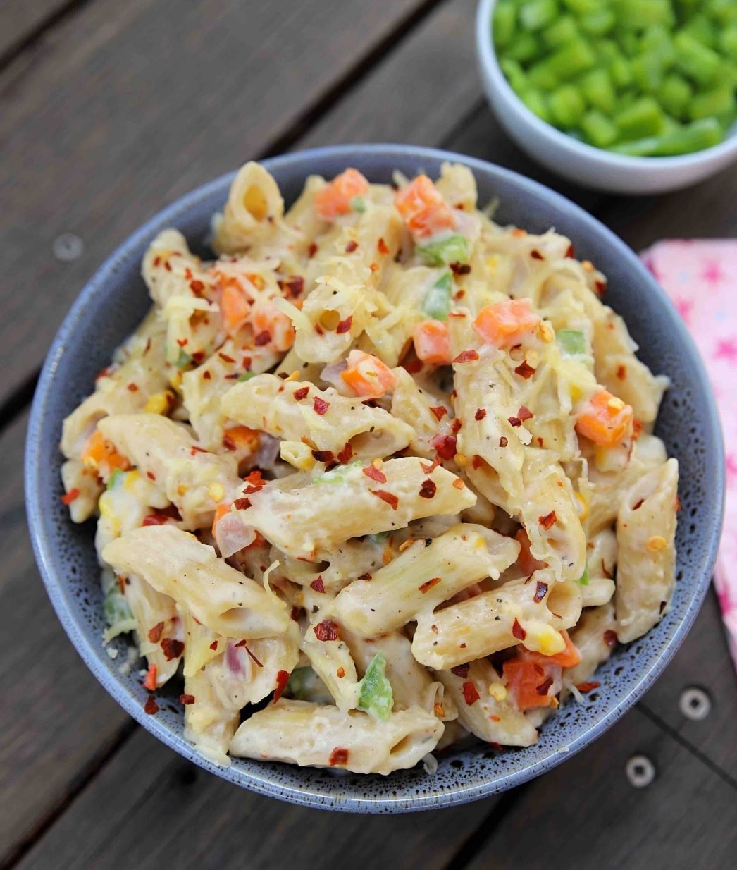 mayo pasta with chopped vegetables and herbs