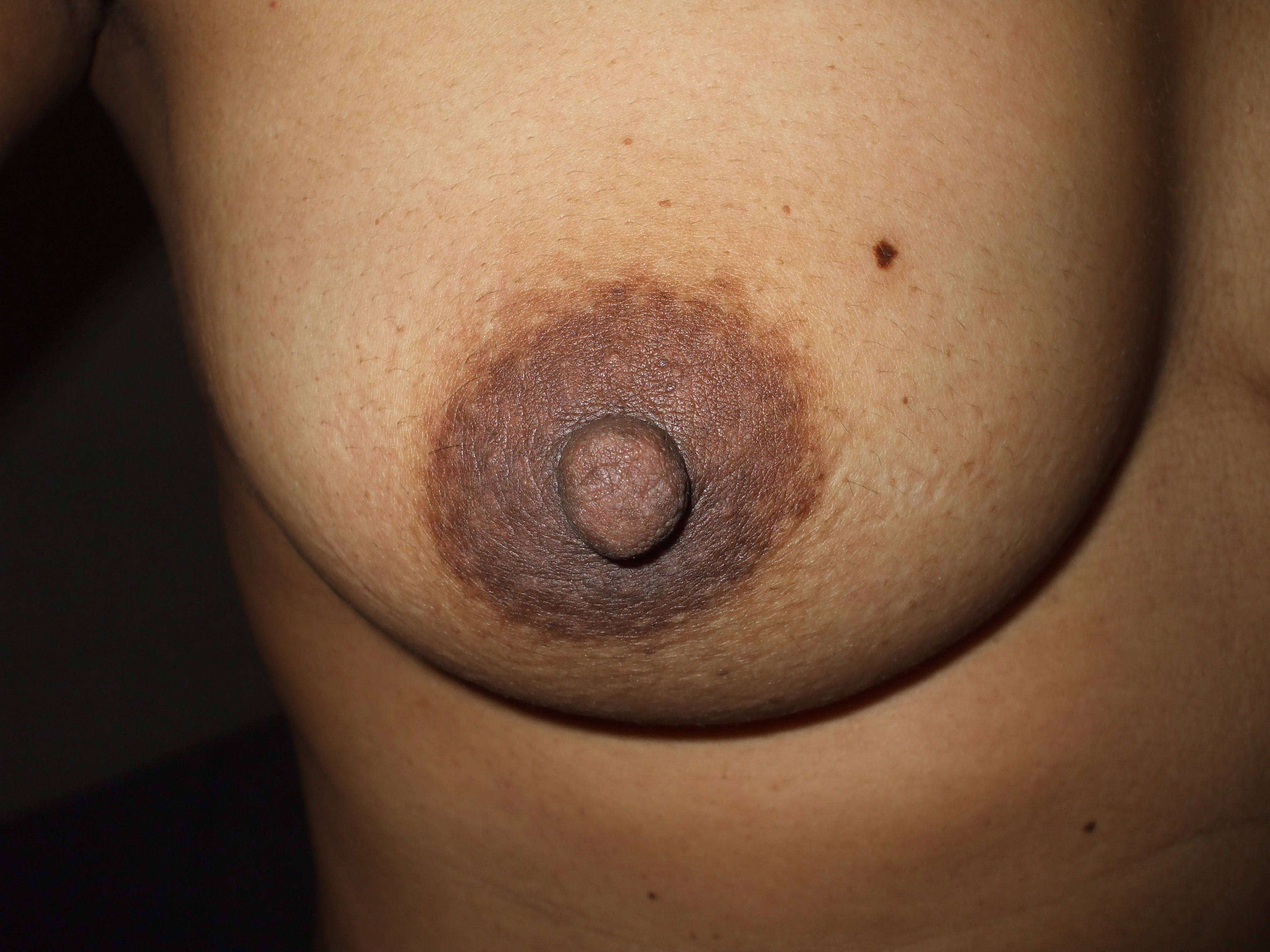 a woman showing her tits and pussy