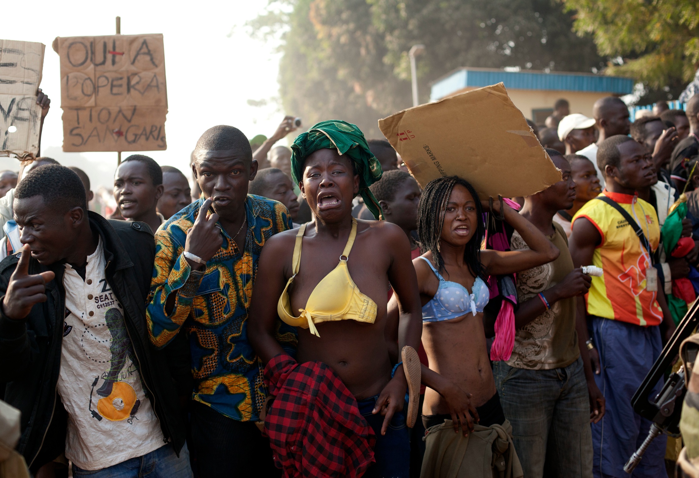 people protesting at Aéroport International in Bangui