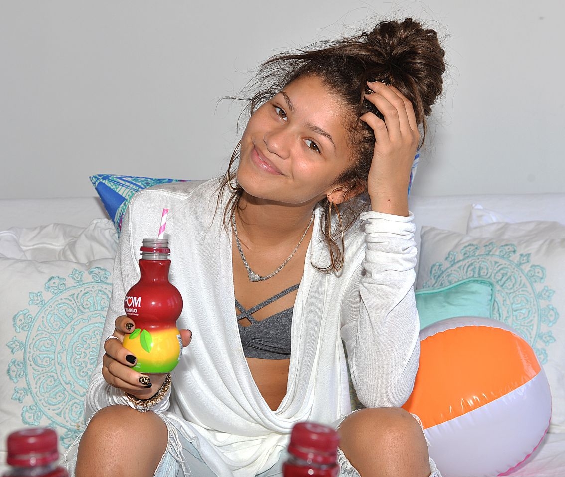 Zendaya holding a bottle of Pom Mango juice