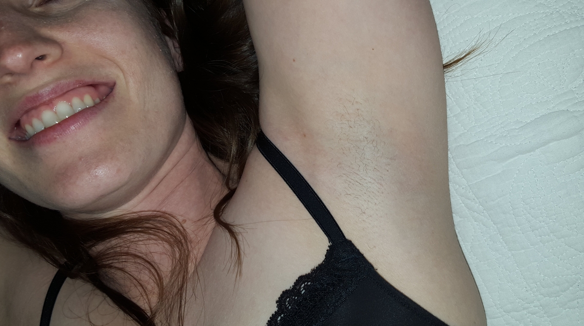 a girl showing her armpit