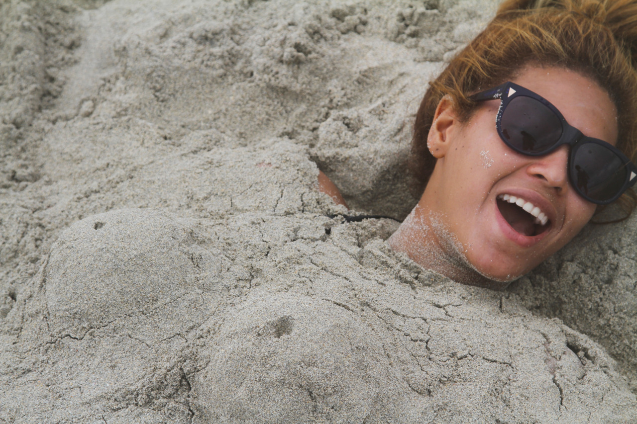 Beyoncé covered in sand
