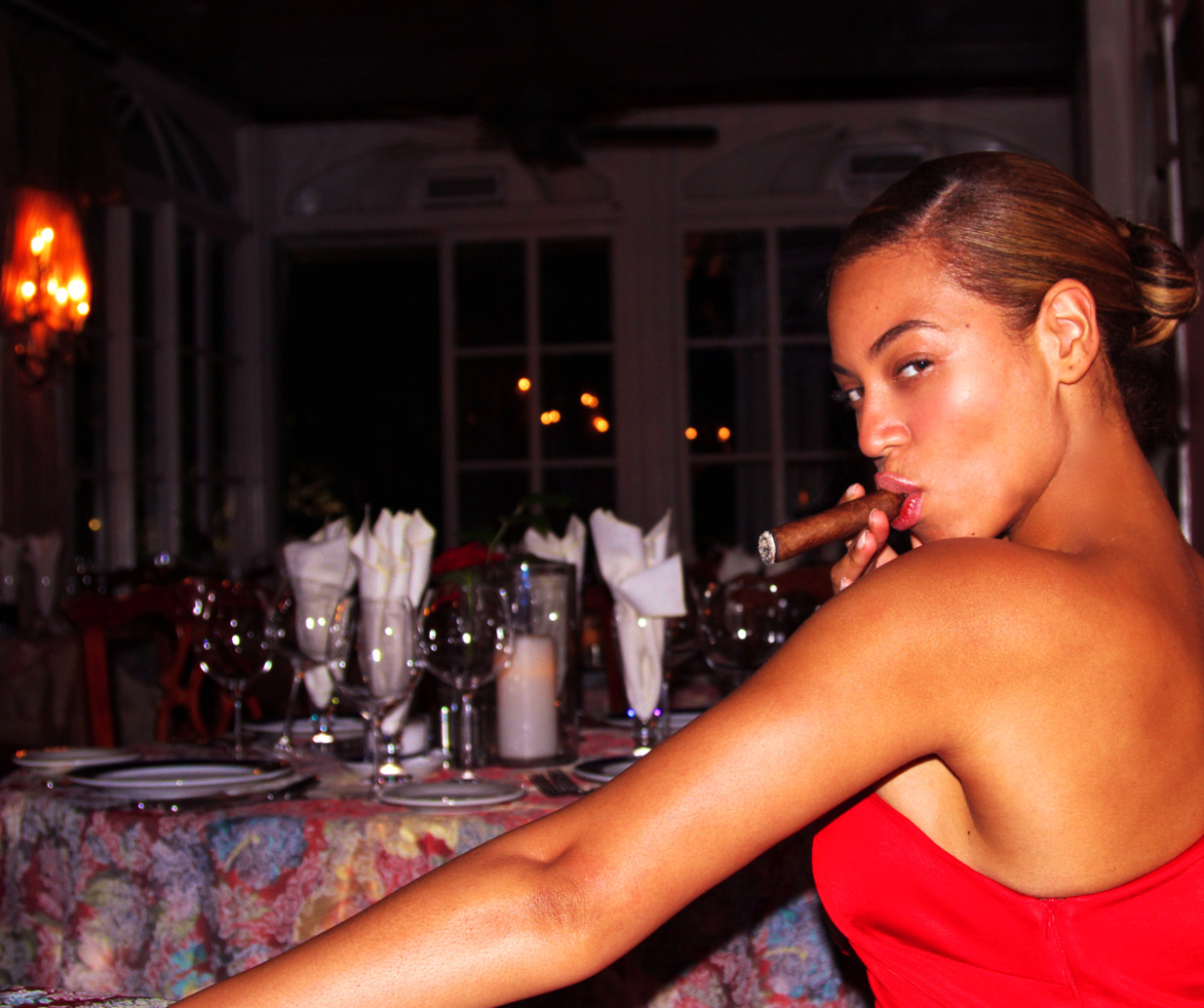 Beyoncé smoking a cigar
