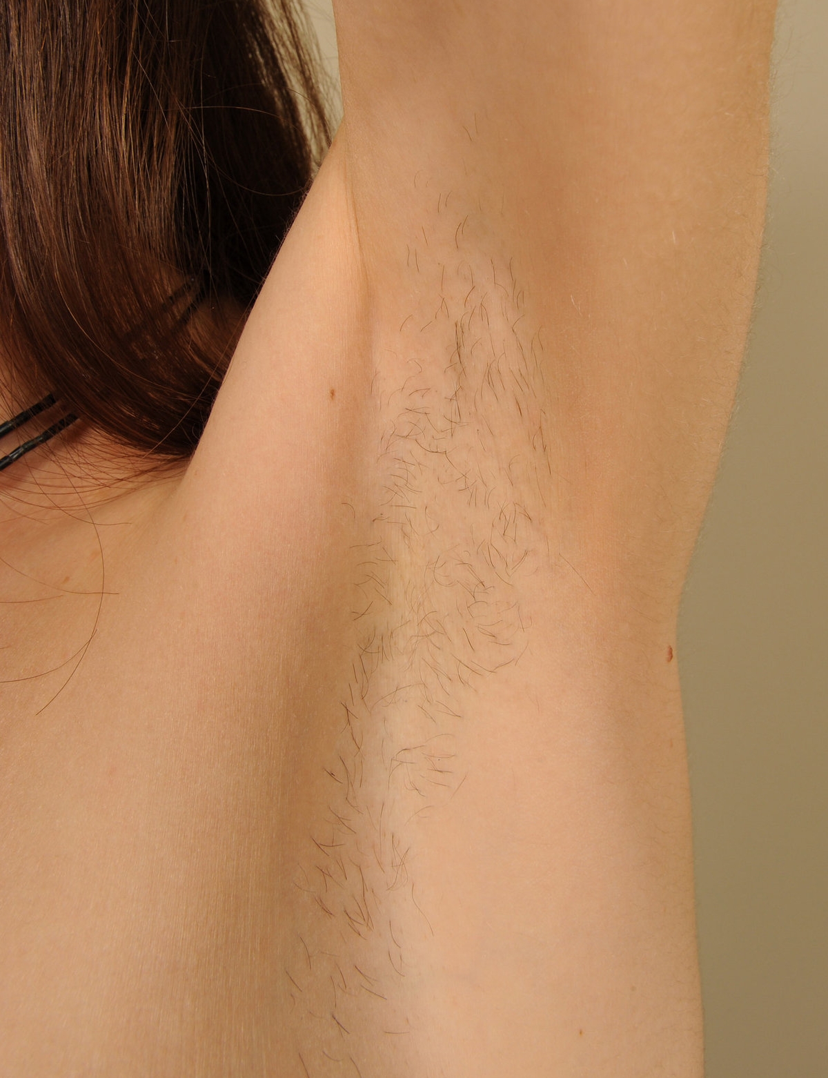 a woman named Abbey showing her armpit hair