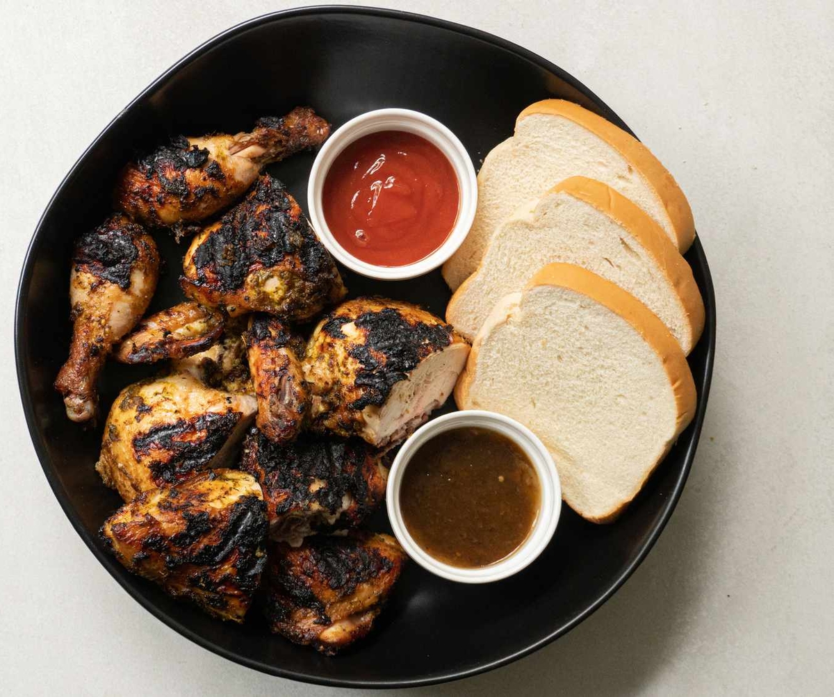 Jamaican pan chicken with sauce and bread