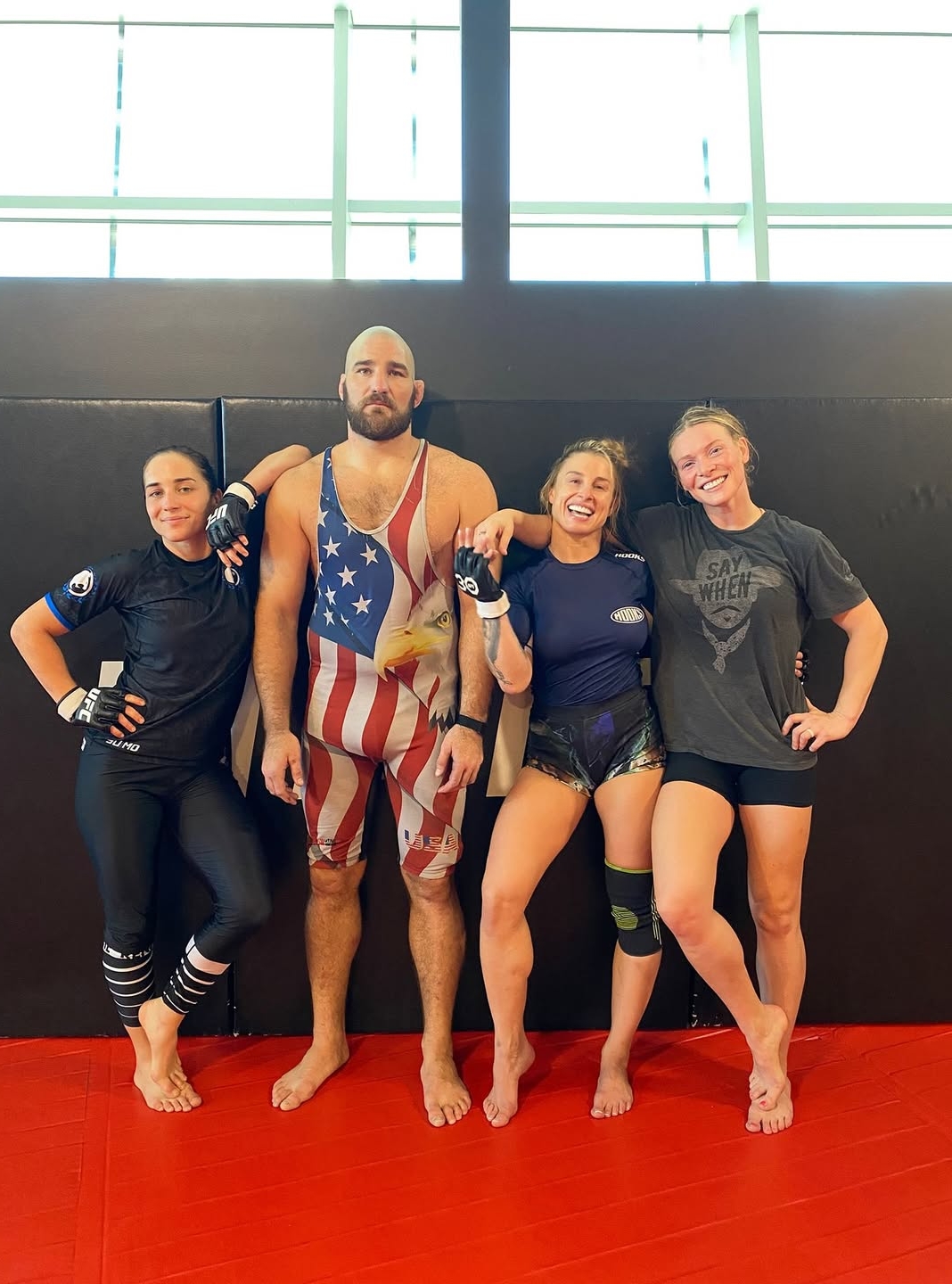 Sean Strickland posing with MMA girls