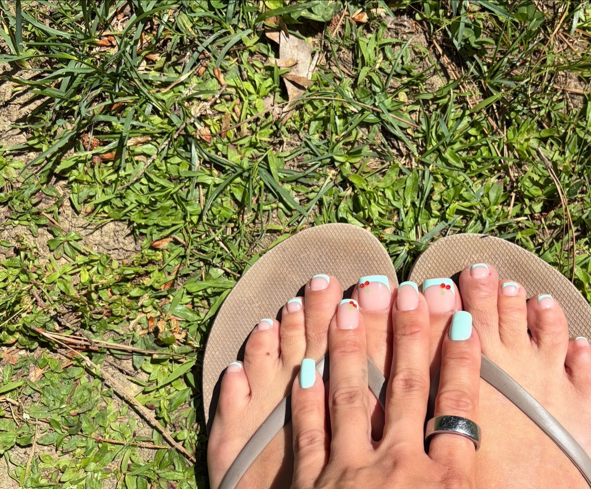 a woman named Kim showing her fingers and toes