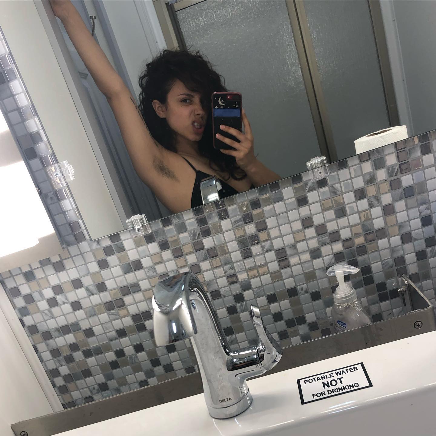 Kiana Madeira showing her armpit hair
