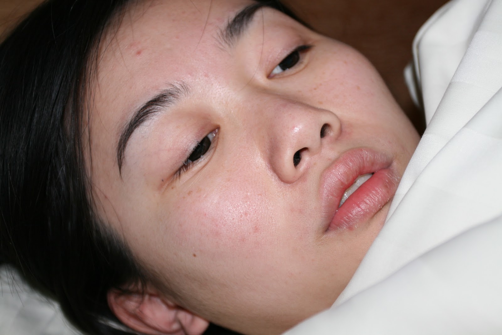 a girl lying in bed