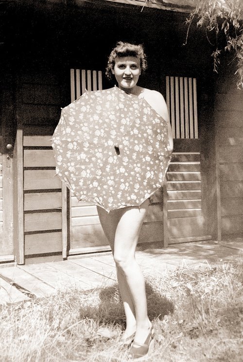 Eva Braun posing with an umbrella