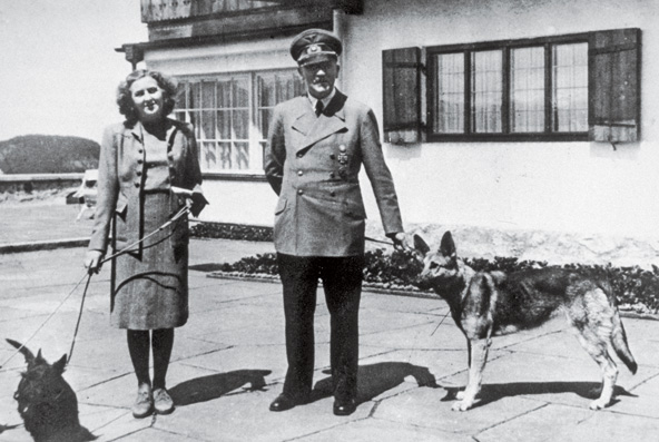 Adolf Hitler and Eva Braun with their dogs
