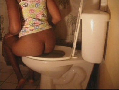 a black girl shitting in a toilet