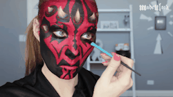 animation : a girl painting her face like Darth Maul