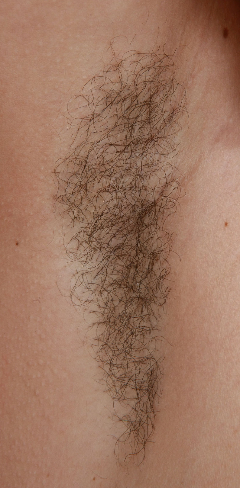 a woman named Rita showing her armpit hair title=