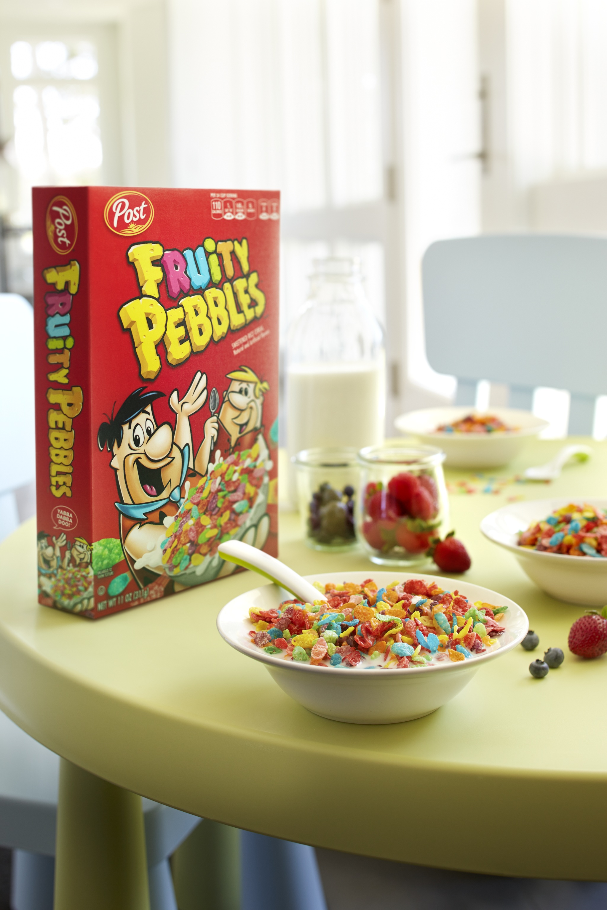 a box and bowl of Fruity Pebbles